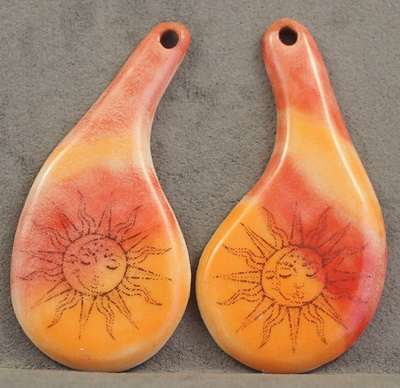Asymetrical Teardrop with sun and Moon Designs